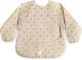 mushie Long Sleeve Baby Bib | Water Resistant Adjustable Fit for Ages 6-24 Months