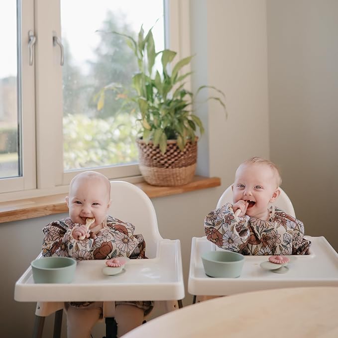mushie Long Sleeve Baby Bib | Water Resistant Adjustable Fit for Ages 6-24 Months
